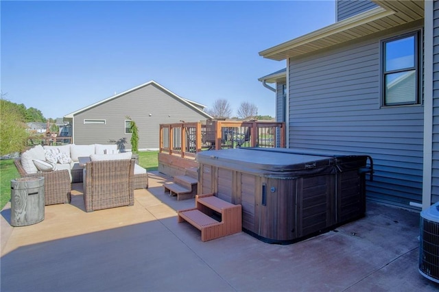 2931 Drier Rd, Eau Claire, WI 54701 - view of patio / terrace with a hot tub, central AC, and an outdoor living space