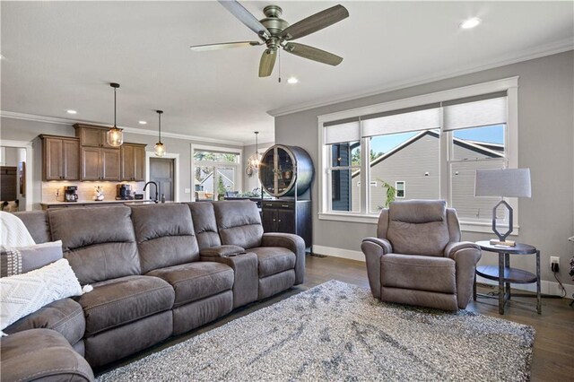 2931 Drier Rd, Eau Claire, WI 54701 - living room with crown molding, baseboards, dark wood finished floors, and ceiling fan