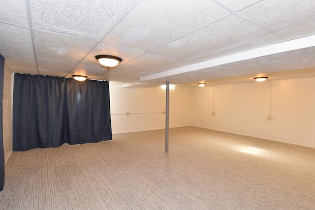finished below grade area with carpet floors and a drop ceiling