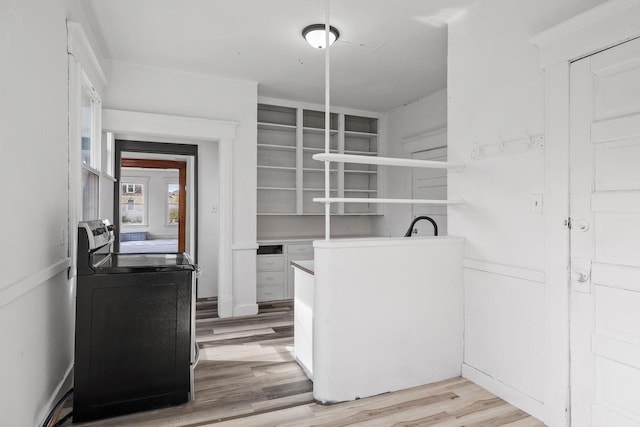 washroom featuring light wood-type flooring and washer / dryer