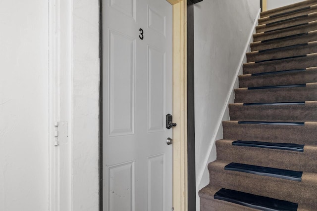 stairs featuring baseboards