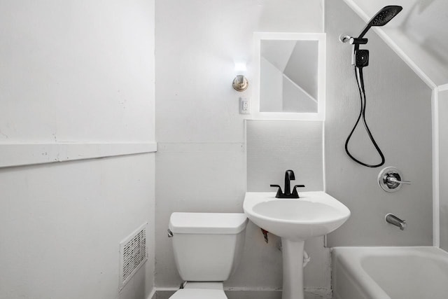 bathroom featuring visible vents, tub / shower combination, and toilet