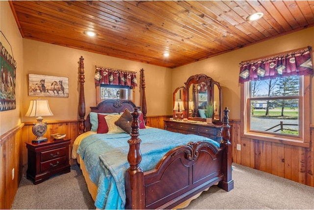 510 State Rd Unit 35, Saint Croix Falls, WI 54024 - carpeted bedroom with wooden walls, a wainscoted wall, wood ceiling, and recessed lighting