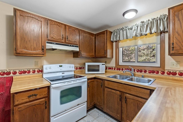 305 Hill Rd, Rosendale, WI 54974 - kitchen with under cabinet range hood, white appliances, a sink, and brown cabinets
