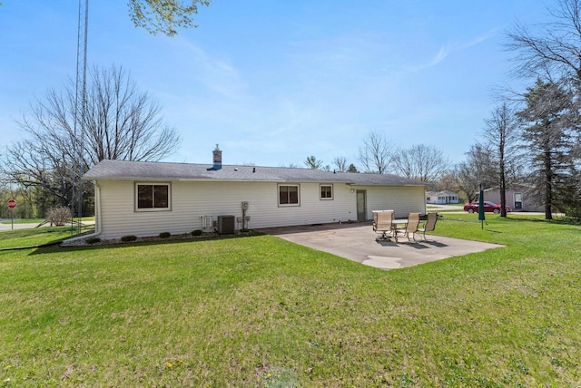 305 Hill Rd, Rosendale, WI 54974 - rear view of property with a patio, central AC, a yard, and a chimney
