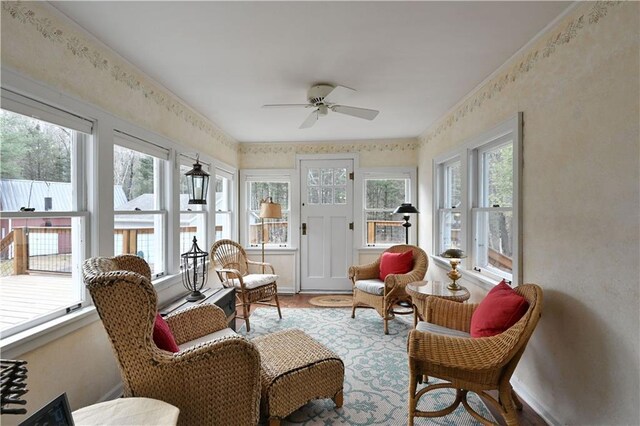 13195 Kavanaugh Rd, Cable, WI 54821 - sunroom / solarium featuring baseboards, wood finished floors, a healthy amount of sunlight, and wallpapered walls