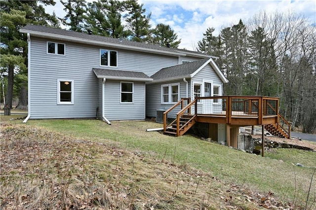 13195 Kavanaugh Rd, Cable, WI 54821 - back of house with a lawn, a wooden deck, and stairway