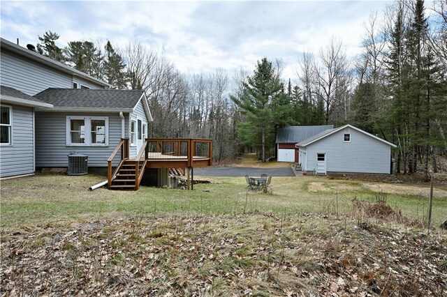 13195 Kavanaugh Rd, Cable, WI 54821 - view of yard featuring a deck, central AC unit, and an outdoor structure