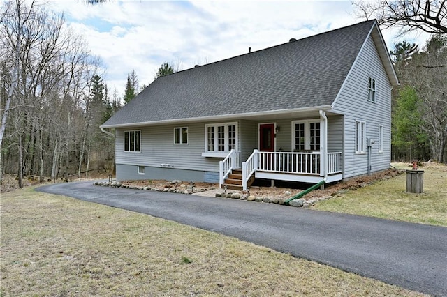 13195 Kavanaugh Rd, Cable, WI 54821 - view of front of house featuring covered porch, a shingled roof, and aphalt driveway