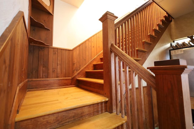 147 N James St, Kimberly, WI 54136 - staircase with wooden walls and wainscoting