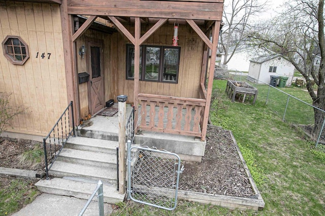 147 N James St, Kimberly, WI 54136 - doorway to property featuring fence and a yard
