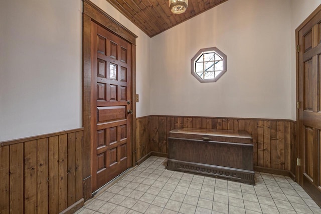 147 N James St, Kimberly, WI 54136 - foyer entrance featuring wooden ceiling, a wainscoted wall, wood walls, and light tile patterned flooring