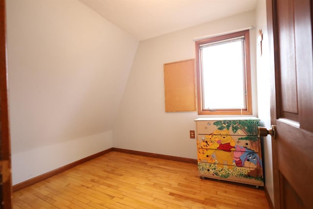 147 N James St, Kimberly, WI 54136 - spare room with baseboards, vaulted ceiling, and light wood finished floors
