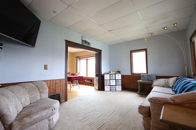 147 N James St, Kimberly, WI 54136 - living area featuring wood walls, a paneled ceiling, a wainscoted wall, and carpet