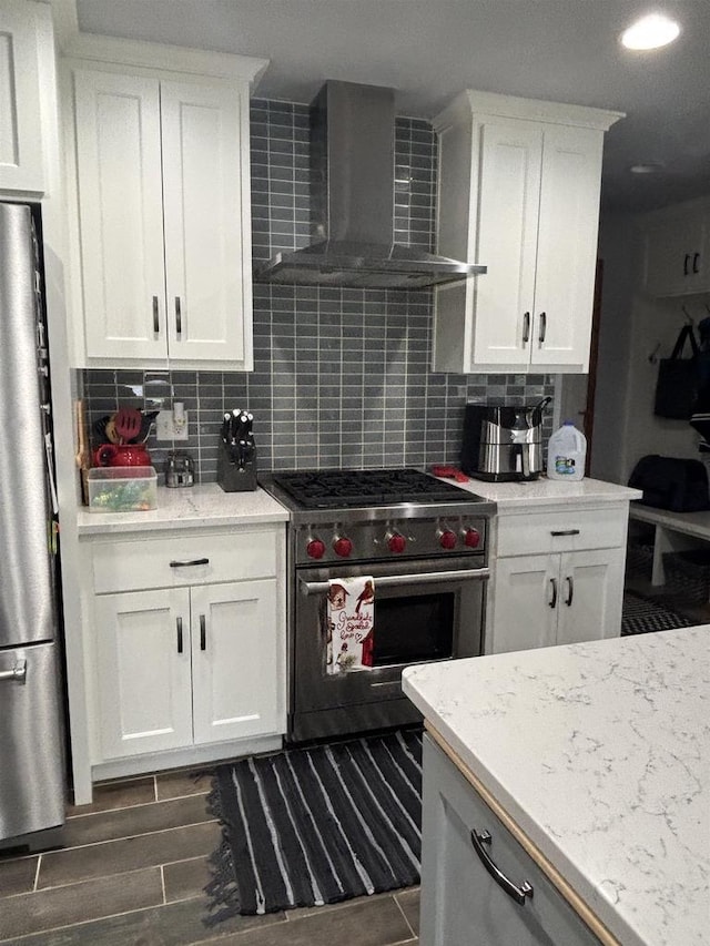 W6517 Greenwood Ct, Greenville, WI 54952 - kitchen with stainless steel appliances, wall chimney exhaust hood, backsplash, white cabinets, and dark wood-style floors