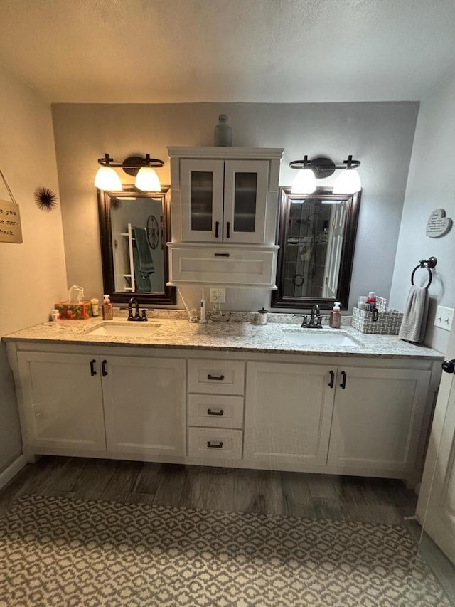 W6517 Greenwood Ct, Greenville, WI 54952 - bathroom with wood finished floors, double vanity, and a textured ceiling