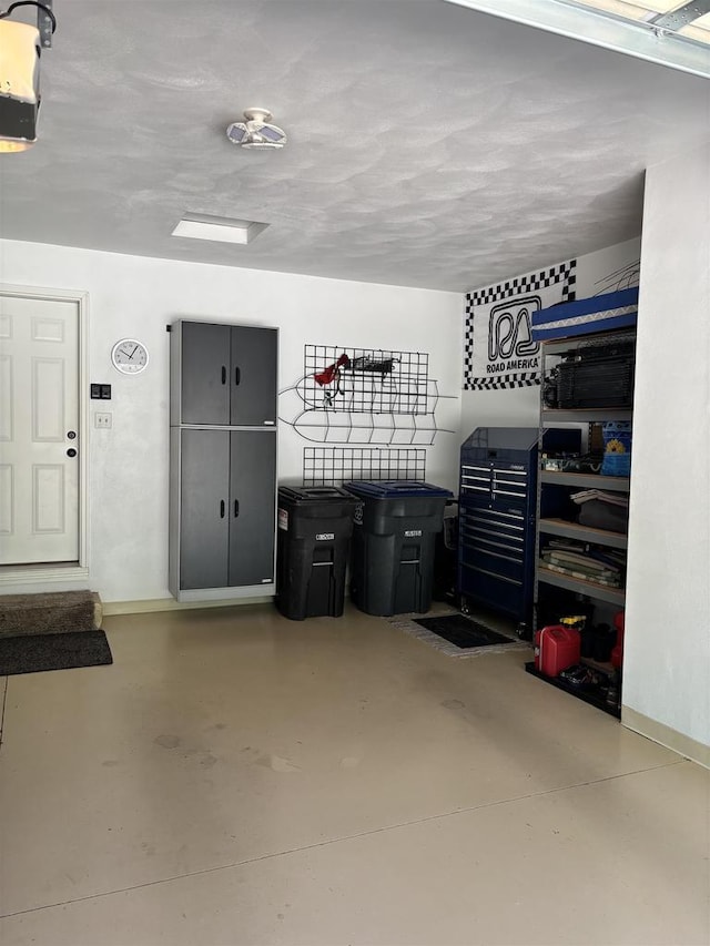 W6517 Greenwood Ct, Greenville, WI 54952 - garage featuring a garage door opener and baseboards