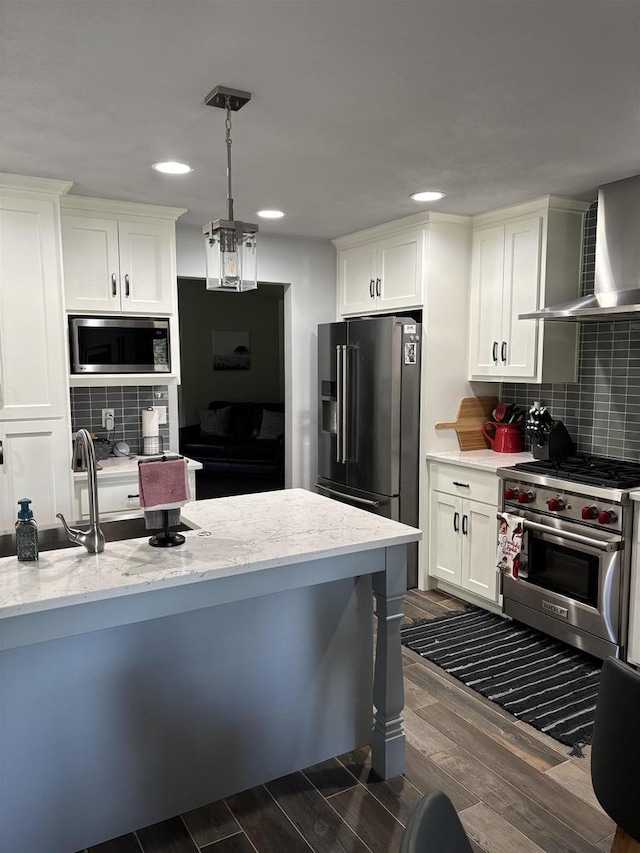 W6517 Greenwood Ct, Greenville, WI 54952 - kitchen featuring high quality appliances, wall chimney range hood, dark wood-style floors, white cabinets, and recessed lighting