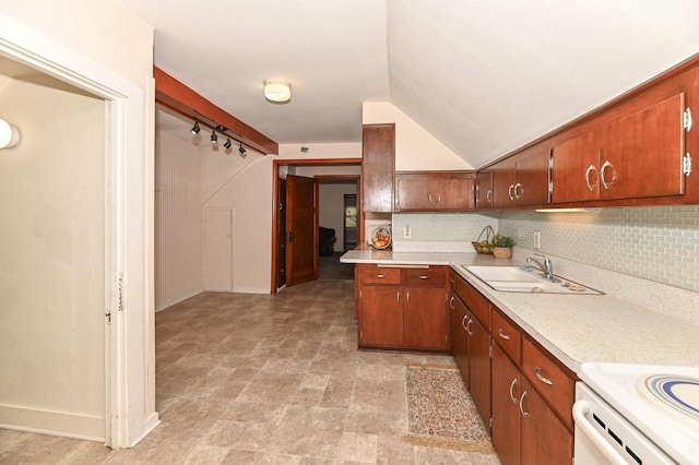 kitchen featuring baseboards, a sink, electric range oven, and light countertops