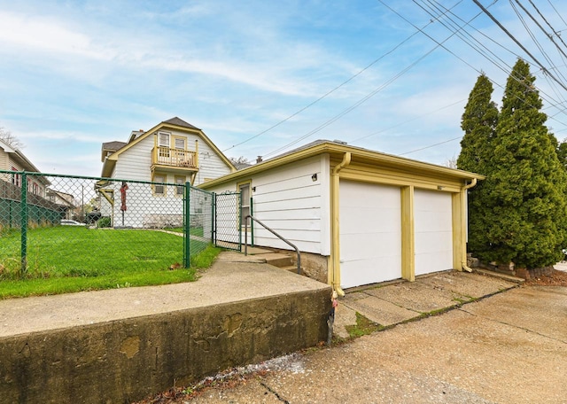 detached garage with fence and a gate
