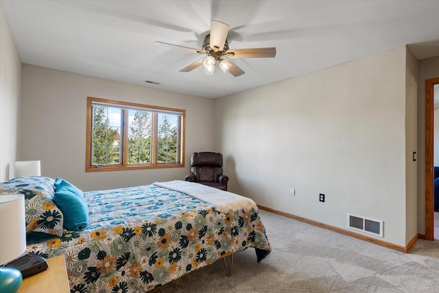 bedroom featuring baseboards, a ceiling fan, light colored carpet, and visible vents