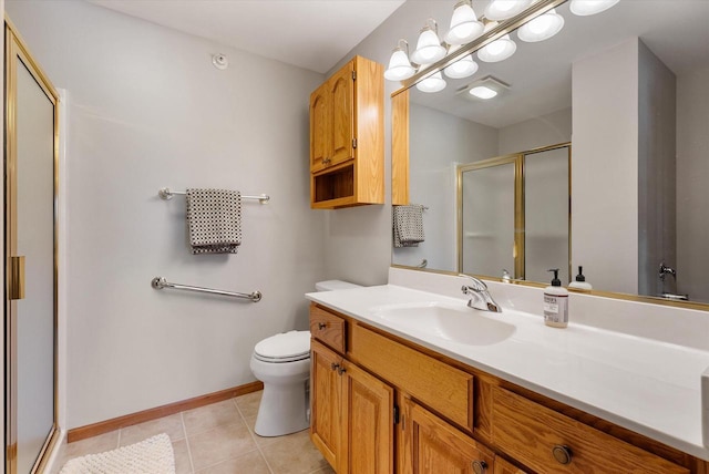 bathroom with tile patterned flooring, vanity, toilet, baseboards, and a stall shower