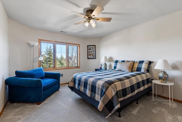 carpeted bedroom with baseboards, ceiling fan, and visible vents