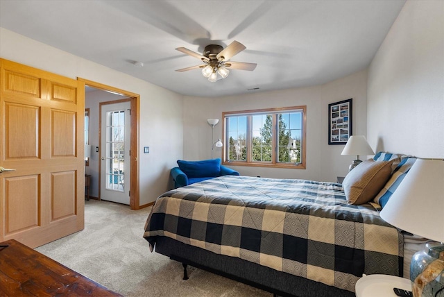 bedroom with light colored carpet and ceiling fan