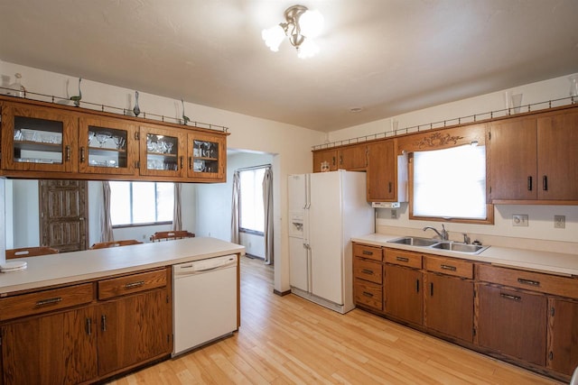 5016 Sth 96, Denmark, WI 54208 - kitchen with white appliances, brown cabinets, a sink, and light countertops