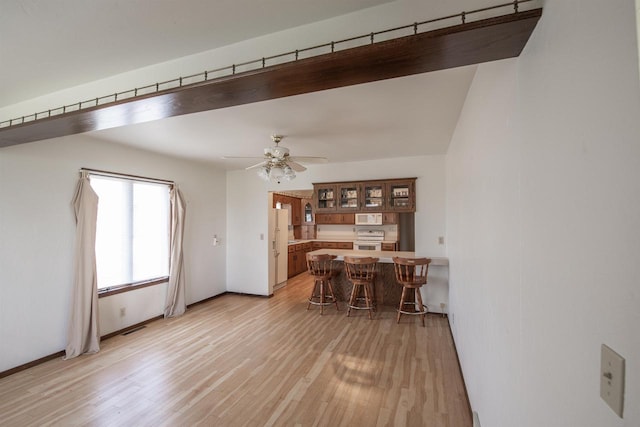 5016 Sth 96, Denmark, WI 54208 - dining area with ceiling fan, baseboards, and light wood-style floors