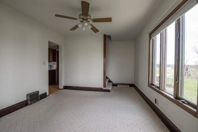 5016 Sth 96, Denmark, WI 54208 - carpeted empty room featuring baseboards, visible vents, and ceiling fan