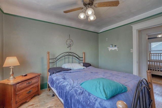 611 N St, West Bend, WI 53090 - bedroom with light wood-style floors, ceiling fan, and lofted ceiling