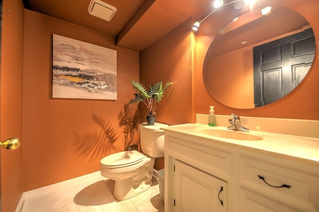 half bathroom with toilet, visible vents, tile patterned flooring, and vanity
