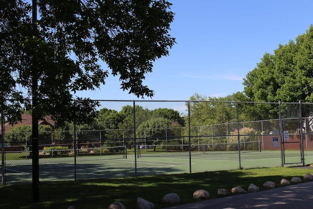 view of sport court with fence