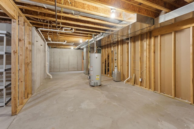 unfinished basement featuring gas water heater