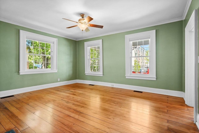 126 S Hancock St, Madison, WI 53703 - empty room with light wood-style flooring, ceiling fan, baseboards, and crown molding