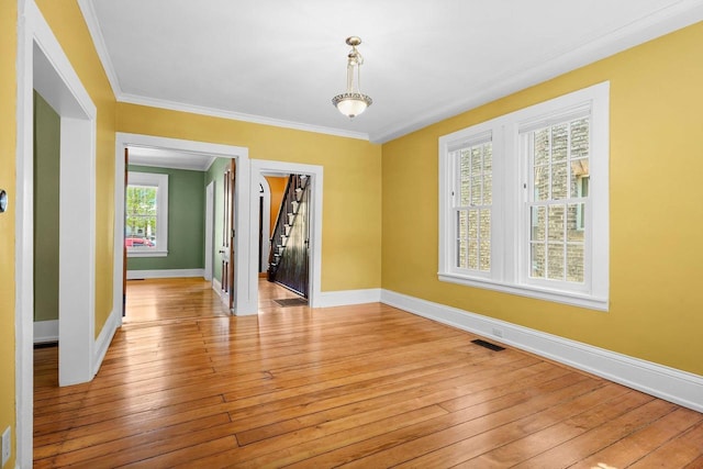 126 S Hancock St, Madison, WI 53703 - spare room featuring baseboards, light wood-style flooring, ornamental molding, and stairs