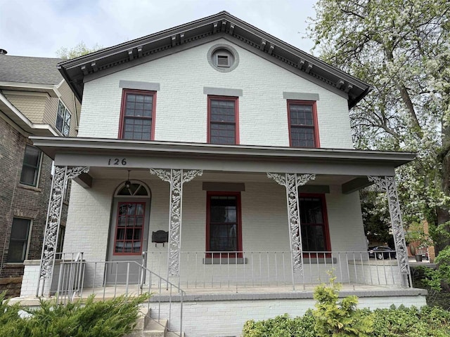 126 S Hancock St, Madison, WI 53703 - italianate house featuring covered porch and brick siding