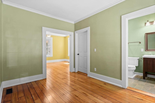 126 S Hancock St, Madison, WI 53703 - empty room with ornamental molding, light wood finished floors, and baseboards