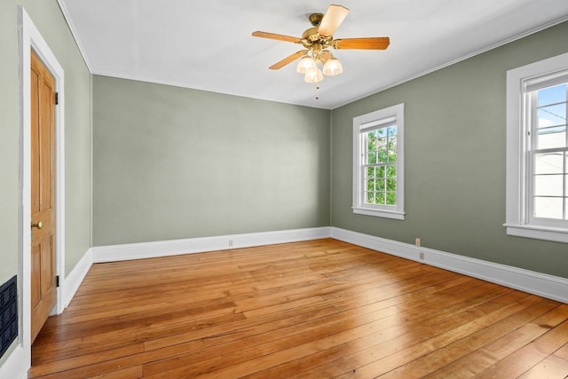 126 S Hancock St, Madison, WI 53703 - empty room with light wood-style floors, baseboards, crown molding, and a ceiling fan