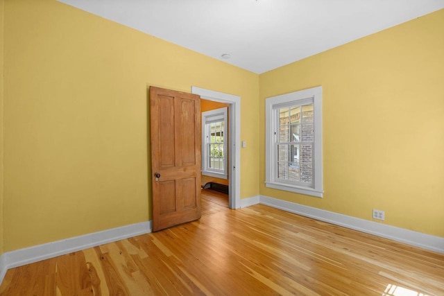 126 S Hancock St, Madison, WI 53703 - empty room with baseboards and light wood-style floors