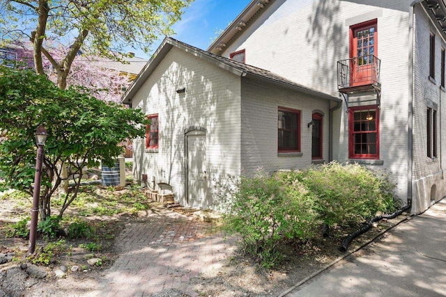 126 S Hancock St, Madison, WI 53703 - view of home's exterior with a balcony and brick siding
