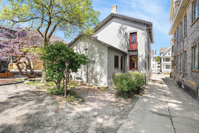 126 S Hancock St, Madison, WI 53703 - back of property featuring a chimney and brick siding
