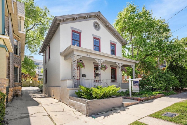 126 S Hancock St, Madison, WI 53703 - italianate home featuring covered porch and stucco siding