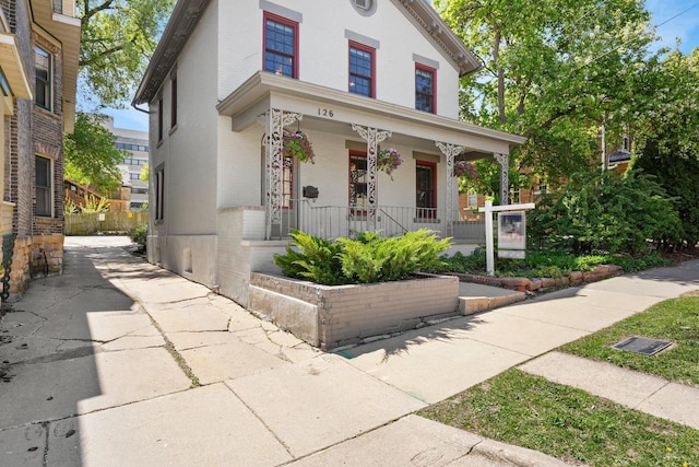 126 S Hancock St, Madison, WI 53703 - view of front of property with a porch and brick siding