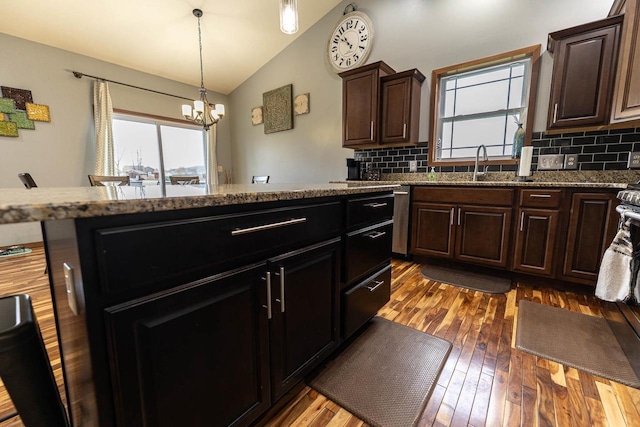 351 Alyssa St, Tomah, WI 54660 - kitchen with a chandelier, vaulted ceiling, decorative backsplash, and a sink