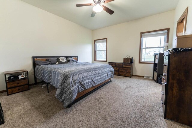 351 Alyssa St, Tomah, WI 54660 - carpeted bedroom featuring baseboards, multiple windows, ceiling fan, and visible vents