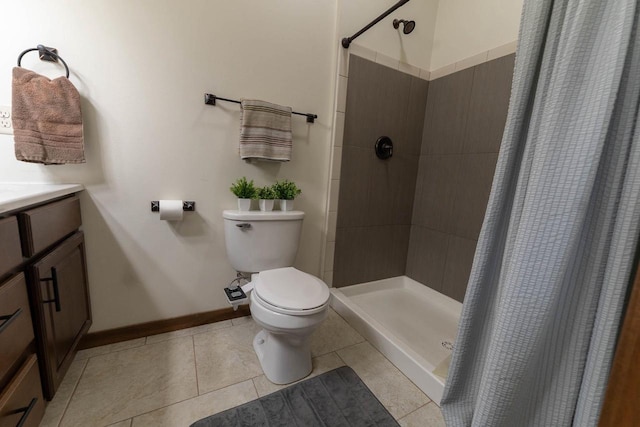 351 Alyssa St, Tomah, WI 54660 - bathroom featuring a stall shower, tile patterned floors, vanity, baseboards, and toilet