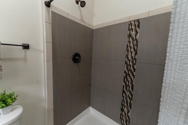 351 Alyssa St, Tomah, WI 54660 - bathroom featuring toilet and tiled shower