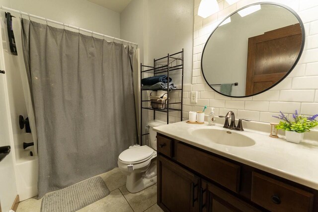 351 Alyssa St, Tomah, WI 54660 - bathroom with shower / bath combo, tile patterned flooring, vanity, toilet, and backsplash